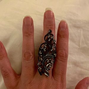 Costume ring. Black paisley print with clear gemstones. Adjustable.